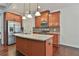 Kitchen featuring a central island, stainless steel appliances, and granite countertops at 5661 Radford Loop, Fairburn, GA 30213
