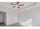 This bedroom features a tray ceiling and ceiling fan at 940 Elwood St, Dacula, GA 30019