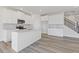 Modern kitchen features white cabinets, granite countertops, and stainless steel appliances at 940 Elwood St, Dacula, GA 30019