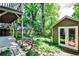 View of backyard from outdoor patio highlighting lush gardens and well-maintained landscaping at 1249 Francis Nw St, Atlanta, GA 30318