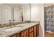 Bathroom featuring double sinks with granite countertops and modern fixtures at 1249 Francis Nw St, Atlanta, GA 30318
