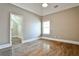 Bedroom with hardwood floors, a closet, and a window at 1249 Francis Nw St, Atlanta, GA 30318