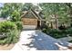 Charming two-story home with brick and siding exterior, well-manicured landscaping, and a spacious driveway at 1249 Francis Nw St, Atlanta, GA 30318