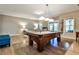 Game room with a pool table, hardwood floors, and a living room area at 1249 Francis Nw St, Atlanta, GA 30318