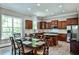 Spacious kitchen with wood cabinets, granite countertops, a kitchen island and a large window with natural light at 1249 Francis Nw St, Atlanta, GA 30318