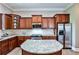 Modern kitchen with granite countertops, stainless steel appliances, wood cabinets, and a kitchen island with seating at 1249 Francis Nw St, Atlanta, GA 30318