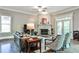 Inviting living room featuring hardwood floors, a fireplace, and comfortable seating, with large windows providing ample light at 1249 Francis Nw St, Atlanta, GA 30318