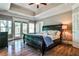 Main bedroom featuring a trey ceiling, hardwood floors, and ample natural light at 1249 Francis Nw St, Atlanta, GA 30318