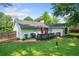 Charming home featuring a back deck and lush green lawn, perfect for outdoor living and entertaining in a serene environment at 4458 Trickum Ne Rd, Marietta, GA 30066