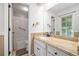 Well-lit bathroom featuring a granite countertop vanity and a shower/tub combination at 4458 Trickum Ne Rd, Marietta, GA 30066