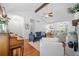 Open-concept living room featuring hardwood floors, exposed beam, and ample seating at 4458 Trickum Ne Rd, Marietta, GA 30066
