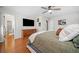 Comfortable main bedroom with hardwood floors, a ceiling fan, decor and attached bathroom at 4458 Trickum Ne Rd, Marietta, GA 30066