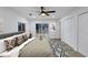 Bright bedroom with ensuite glass doors to patio, ceiling fan, and closet at 923 Smith Sw St, Atlanta, GA 30310