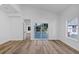 Bright, open bedroom with wood floors and a sliding glass door that leads to the deck at 923 Smith Sw St, Atlanta, GA 30310