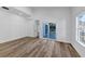 Bright bedroom features wood floors and a sliding glass door providing natural light and access to the deck at 923 Smith Sw St, Atlanta, GA 30310
