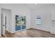 Bright, open dining area with wood floors, sliding glass door that leads to the deck at 923 Smith Sw St, Atlanta, GA 30310