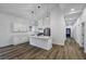 Bright kitchen featuring white cabinets, stainless steel appliances, and a large island at 923 Smith Sw St, Atlanta, GA 30310