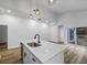 Bright kitchen featuring a large island with sink, modern pendant lights and stainless appliances at 923 Smith Sw St, Atlanta, GA 30310