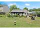 Large backyard featuring a gazebo with lush landscaping, and ample space at 2125 Mina Lane Dr, Buford, GA 30518