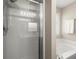 This primary bath features a bathtub and shower with a window at 2125 Mina Lane Dr, Buford, GA 30518