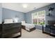 This bedroom offers 2 beds and is painted in a relaxing blue tone at 2125 Mina Lane Dr, Buford, GA 30518