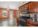 Charming kitchen with stainless steel appliances and tile backsplash at 2125 Mina Lane Dr, Buford, GA 30518
