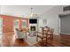 Bright and airy living room featuring hardwood floors, a cozy fireplace, and ample seating at 2125 Mina Lane Dr, Buford, GA 30518