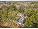 Aerial view of apartments with a parking lot and lush surrounding trees at 2340 Beaver Ruin Rd # 68, Norcross, GA 30071
