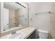 Bathroom with large vanity, ample lighting, and tile backsplash at 2340 Beaver Ruin Rd # 68, Norcross, GA 30071