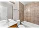 Tiled bathroom with tub-shower combination and modern fixtures at 2340 Beaver Ruin Rd # 68, Norcross, GA 30071