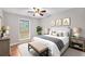 Bedroom featuring warm decor, carpet, and large window at 2340 Beaver Ruin Rd # 68, Norcross, GA 30071