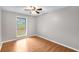 Bedroom with hardwood floors, ceiling fan, and bright windows at 2340 Beaver Ruin Rd # 68, Norcross, GA 30071