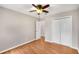 Spacious bedroom with ceiling fan, wood floors, and ample closet space at 2340 Beaver Ruin Rd # 68, Norcross, GA 30071