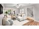 Bright living room with contemporary furnishings, ceiling fan, and open staircase access at 2340 Beaver Ruin Rd # 68, Norcross, GA 30071