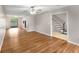 Spacious living room featuring hardwood floors and staircase leading to the upper level at 2340 Beaver Ruin Rd # 68, Norcross, GA 30071
