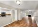 Open concept living space with access to the kitchen, fireplace, and hardwood flooring at 2340 Beaver Ruin Rd # 68, Norcross, GA 30071