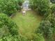 Aerial view of a home with a large, lush backyard and an inviting gazebo at 2835 Channing Way, Cumming, GA 30040