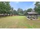 Large backyard with a gazebo, seating, and a hanging chair; perfect for entertaining at 2835 Channing Way, Cumming, GA 30040