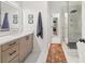 This bathroom features a glass shower, long vanity, and neutral paint at 2835 Channing Way, Cumming, GA 30040