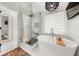 This bathroom has a glass shower, a soaking tub, and lots of natural light at 2835 Channing Way, Cumming, GA 30040