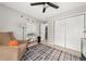 A view of the bedroom with hardwood floors, an area rug, and natural lighting at 2835 Channing Way, Cumming, GA 30040