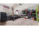 Well-organized garage with shelving, storage containers, and a secure safe at 2835 Channing Way, Cumming, GA 30040