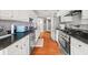 Bright kitchen with stainless steel appliances, granite countertops, and hardwood floors at 2835 Channing Way, Cumming, GA 30040