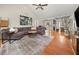 Spacious living room with hardwood floors, vaulted ceiling, fireplace, and open floor plan at 2835 Channing Way, Cumming, GA 30040