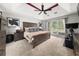 This main bedroom has a tray ceiling, lots of natural light, and hardwood furniture at 2835 Channing Way, Cumming, GA 30040