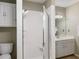 Clean bathroom features a shower, toilet, sink, and white cabinets for storage at 5107 Old Chestnut Ct, Woodstock, GA 30188