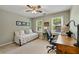 Bedroom with a bed and a desk set up perfect for an office space at 5107 Old Chestnut Ct, Woodstock, GA 30188