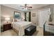 Bedroom features neutral walls, carpet, a queen bed, and a matching dresser at 5107 Old Chestnut Ct, Woodstock, GA 30188