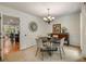 Elegant dining room with stylish chandelier and wainscoting at 5107 Old Chestnut Ct, Woodstock, GA 30188