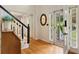 Bright foyer with hardwood floors and a view to the landscaped front yard at 5107 Old Chestnut Ct, Woodstock, GA 30188
